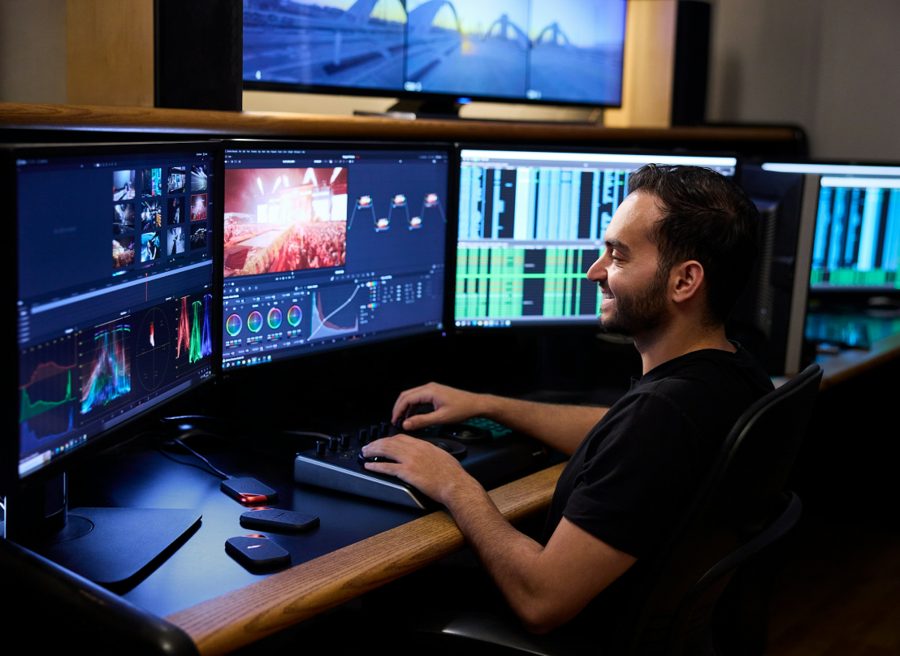 A NyotaCore engineer at a multi-monitor workstation
